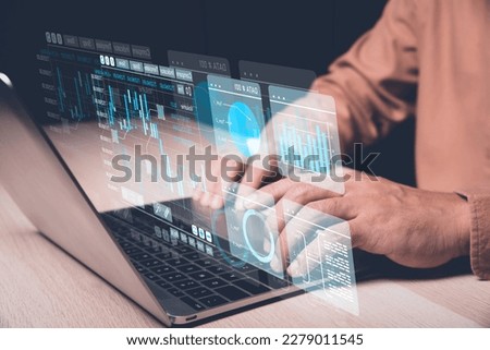 Analyst working with Business Analytics and Data Management System on computer, make a report with KPI and metrics connected to database. Corporate strategy for finance, operations, sales, marketing