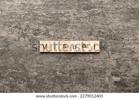 visual word written on wood block. visual text on table, concept.