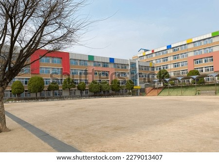 elementary school and kindergarten (playground, tree) Royalty-Free Stock Photo #2279013407