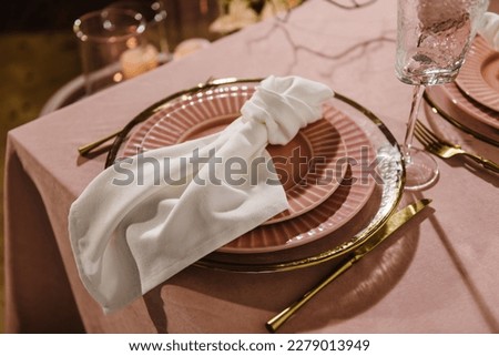 Setting table in restaurant. Location decoration, decor candles for surprise marriage proposal. Luxury candle light dinner setup for couple on Valentine's day. Romantic date. Side view. Closeup detail