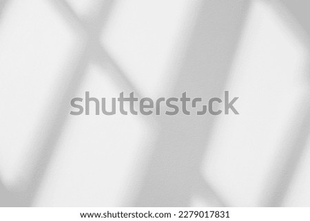 Abstract light reflection and grey shadow from window on white wall background, dark gray shadows and sunshine overlay effect for backdrop and mockup design
