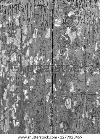 evocative black and white image texture of ruined surface of wood