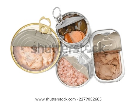 Open tin cans with different products on white background, top view