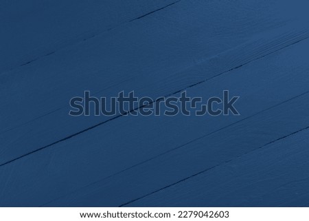Texture of dark blue wooden surface as background, closeup