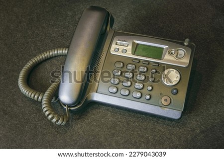DECT radiotelephone Base station. Dect cordless phone wireless phone, radiotelephone, radio phone on grey background. Royalty-Free Stock Photo #2279043039
