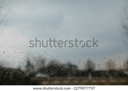 Raindrops on glass, water texture, rainy day