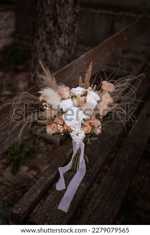 Boho bridal bouquet. White and peach wedding bouquet. Wedding day.