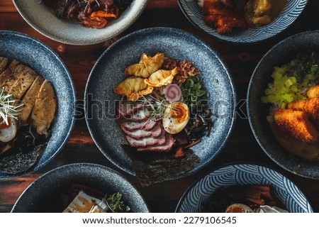 Indulge in the Exotic Flavors of Thai and Asian Cuisine with Savory Delights: A Top-Down Food Photography Collection. Vibrant ingredients, intricate garnishes, and stunning presentation come together  Royalty-Free Stock Photo #2279106545