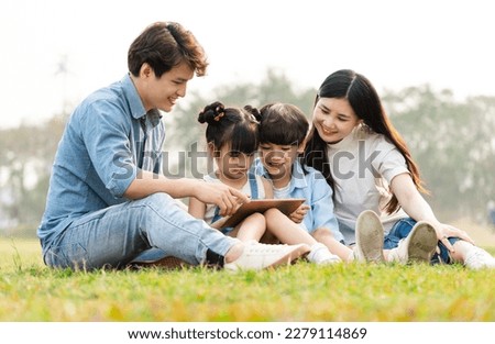 Image of an Asian family in the park