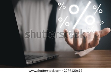 Concept of financial interest rates and dividends provision of financial services.Businessman showing percentage icons and up arrow icons. Interest Rates Stocks Finance Ratings Mortgage Rates.