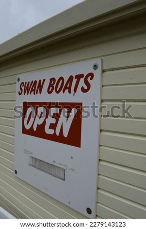 swan boats open sign in park