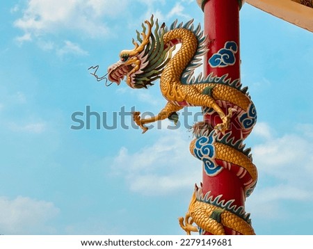 Dragon statue,  dragon symbol, dragon Chinese, is a beautiful Thai and Chinese architecture of shrine, temple. A symbol of good luck and prosperity during the Chinese New Year celebrations. Royalty-Free Stock Photo #2279149681