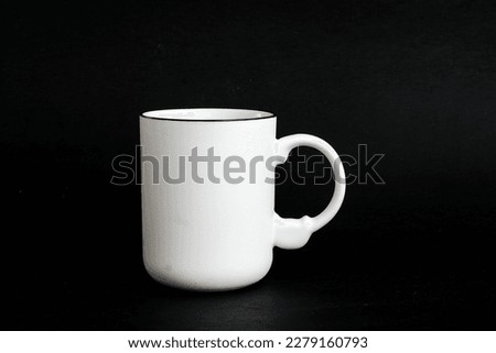 White mug. White cup with red heart for tea or coffee on background.
