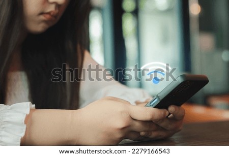 Unhappy young asian woman employee work from home using smartphone videocall meeting conference angry annoy with low poor unreliable internet wifi connection problem issue outage. Royalty-Free Stock Photo #2279166543