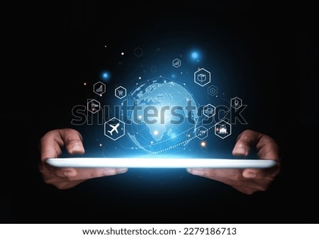 Hand of businessman showing global logistics network on tablet, Futuristic innovation, Smart transport technology concept. Royalty-Free Stock Photo #2279186713