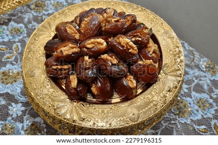 Traditional Moroccan stuffed dates with Dulce de leche and almonds served with milk

