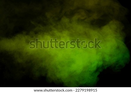 Yellow and green steam on a black background. Copy space.