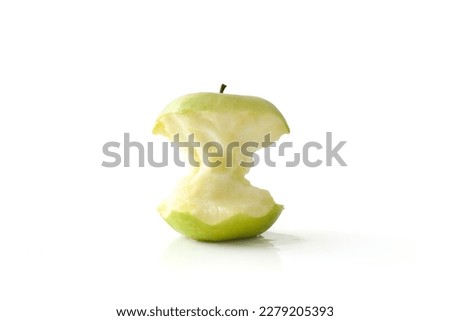 Tasty half eaten green apple reflected on white table and white isolated background. Front view. Royalty-Free Stock Photo #2279205393