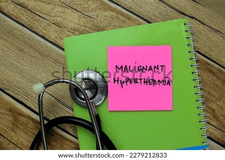 Concept of Malignant Hyperthermia write on sticky notes with stethoscope isolated on Wooden Table. Royalty-Free Stock Photo #2279212833