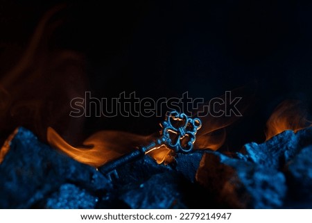 Mystical key is on fire on the rocks.
Fantastic and fabulous composition on dark background. Panoramic view of the fog. Layout for your logo. 