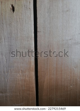Old dark wooden wall, detailed background. Wood plank fence close up. Old wood background. İmage of cracked old tree texture.