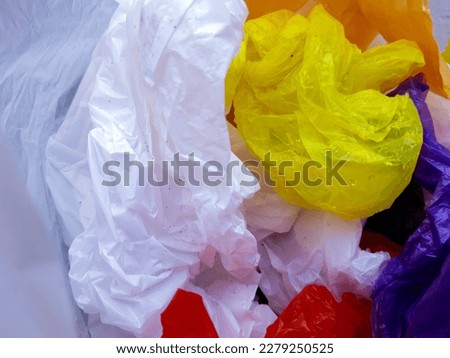 Multiple color trash plastic bag with wood texture for background
