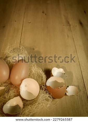 Background texture of egg and egg shells on the wooden background, design for card, invitation easter theme