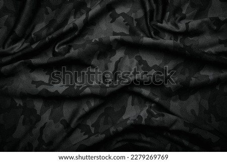 Camouflage pattern. Trendy dark gray camouflage fabric. Military texture. Dark background. Royalty-Free Stock Photo #2279269769