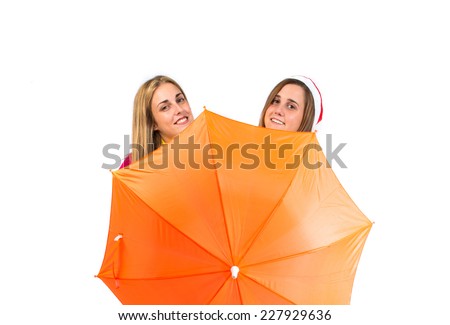 Christmas women with umbrella over white background