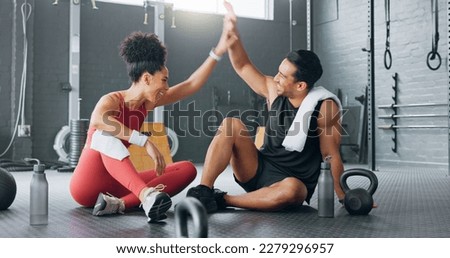 High five, fitness and happy man and women water drink after training workout in gym together. Healthy sports coach, exercise motivation partnership goal success and target team hydrate on floor