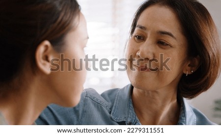 Middle aged asia people old mom love care trust comfort help young teen talk crying stress relief at home. Mum as friend listen adult child woman feel pain sad worry of broken heart life crisis issues Royalty-Free Stock Photo #2279311551