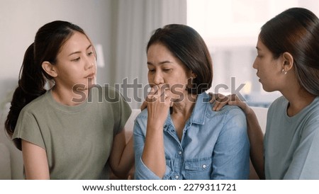 Asia people adult child help middle aged old mom crying grief loss tired hold hand stress relief talk with love care at home. Young woman listen to older mum pain sad worry lost in life crisis issues. Royalty-Free Stock Photo #2279311721