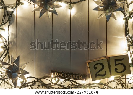 Christmas lights on wooden background 
