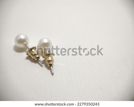 simple earrings, with freshwater pearls at the end, locally made, perfect for girl's earrings