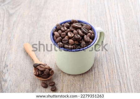 A coffee bean is a seed of the Coffea plant and the source for coffee. It is the pip inside the red or purple fruit. This fruit is often referred to as a coffee cherry.