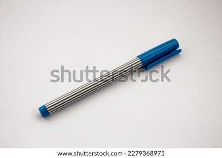 Blue ball point pen isolated on white background