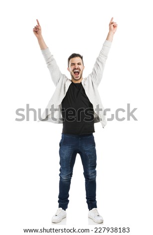 Successful young latin man with arms up Royalty-Free Stock Photo #227938183