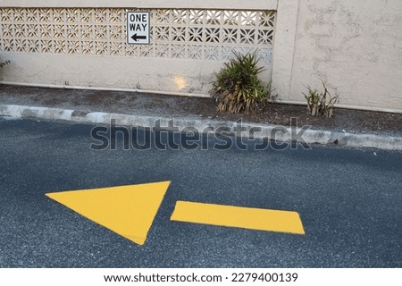 One-Way Sign and One-Way Yellow Ground Arrow