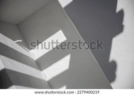 shadows and angles on white painted cement walls