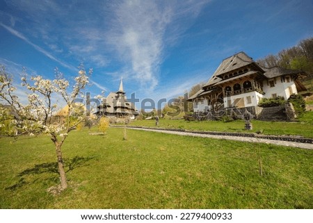 Old wooden church at Barsana Monastery in spring in Maramures county, Romania