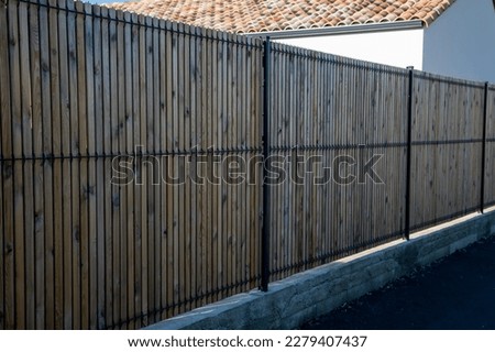 palisade wooden modern panel fence for home protect garden house Royalty-Free Stock Photo #2279407437