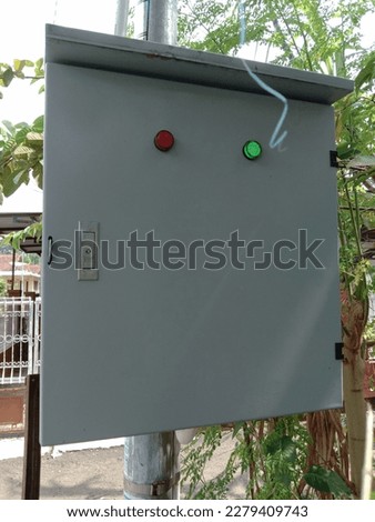 The electric power meter box is installed on one of the public street lighting electricity poles