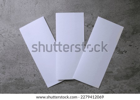 Three blank flyer over gray background to replace your design