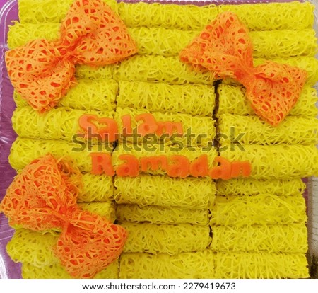 Salam Ramadan! This is a picture of traditional Malay food called "roti jala" beautifully decorated on a plate. Roti jala is a delicacy made from flour, eggs,  coconut milk and it served with curry 