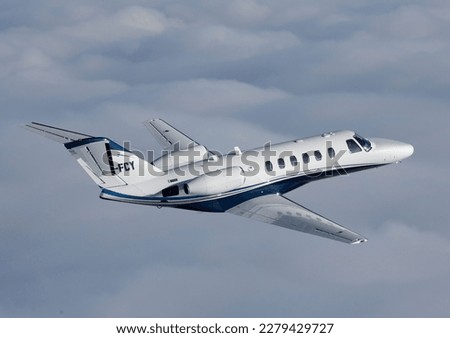 Cessna Citation in flight, business jet, private jet, or bizjet is a jet aircraft designed for transporting small groups of people. Business jets may be adapted for other roles, such as the evacuation Royalty-Free Stock Photo #2279429727