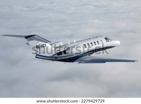Cessna Citation in flight, business jet, private jet, or bizjet is a jet aircraft designed for transporting small groups of people. Business jets may be adapted for other roles, such as the evacuation Royalty-Free Stock Photo #2279429729