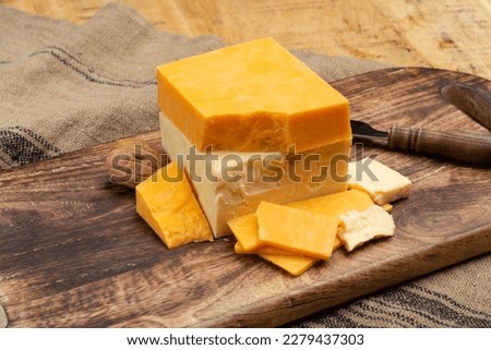British cheeses collection, Scottish coloured and English matured cheddar cheeses close up Royalty-Free Stock Photo #2279437303