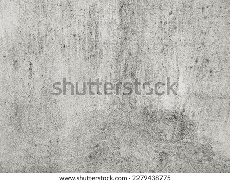 An old gray cement surface background. Damaged concrete wall with detailed grunge texture. Add depth and organic texture to your designs. Minimal urban photo.