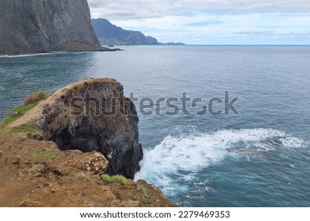 The rocky coast of the island in the ocean. Rest on the island