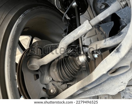 steering rack tie rod of left wheel is checked during the maintenance with inner and outer tie rod end, control coil springs , ball joint and rack pinion unit by machanic before going long trip Royalty-Free Stock Photo #2279496525